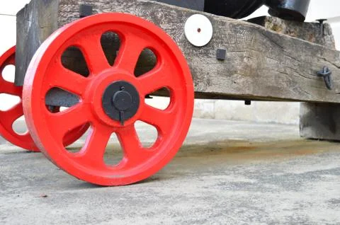 Red wheels of a cannon Stock Photos