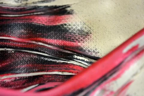 Red, white, black plastic wavy, swirling lines, thin and thick stripes. Stockfoto's
