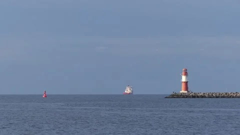 Red white lighthouse at the baltic sea - rostock port panorama Stock Footage 140667252