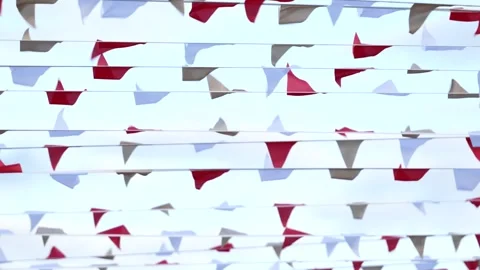Red white pennant flags fluttering celebrating festival outdoors Video stock 320494138