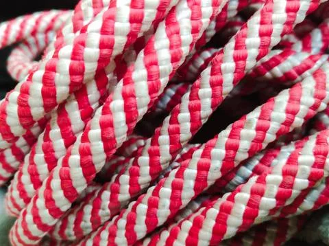 Red white rope roll close up. nylon rope Stock Photos