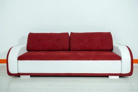 Red-white sofa on a white background Stock Photos