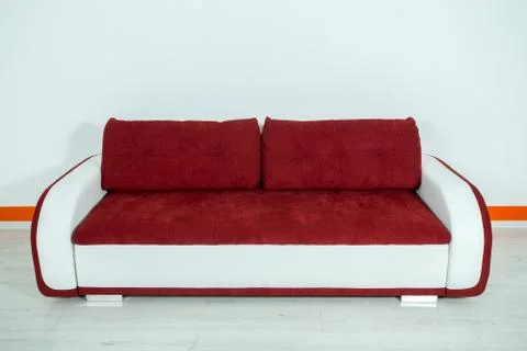 Red-white sofa on a white background Stock Photos