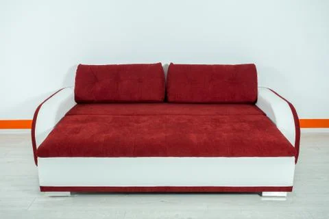 Red-white sofa on a white background Stock Photos