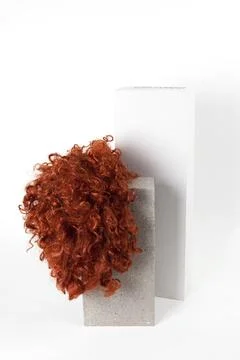 Red wig cinder block Stock Photos