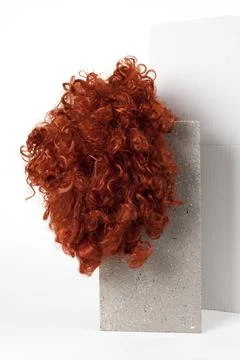 Red wig cinder block Stock Photos