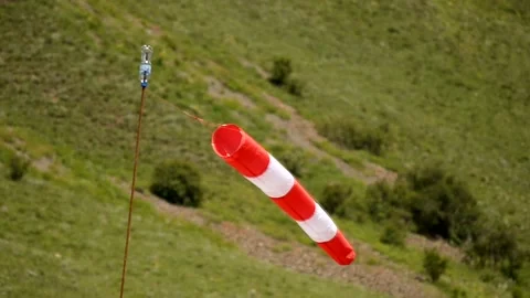 Red wind pointer fluttering in the wind Stock Footage 213875992