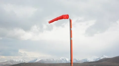 Red Wind Sock on a Windy Day in the Mountains Stock Footage 67214054
