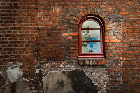 Red window on a brick wall Stock Photos