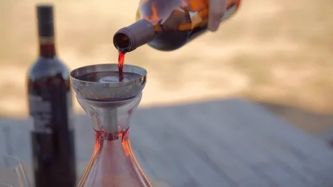 Red wine being poured at sunset Stock Footage 112363388