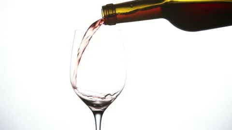Red wine being poured into a wine glass Stock Footage 24668338