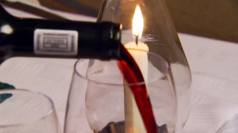Red wine being poured into wine glass Stock Footage 54590916