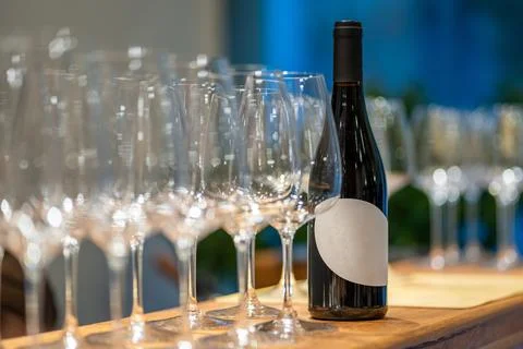Red wine bottle and empty glasses preparing for tasting Stock Photos