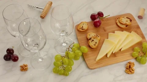 Red wine, cheese, bread and grapes at tasting Video stock 73570517