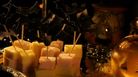 Red wine in a composition with candles and snacks on Halloween Stock Footage 68784584