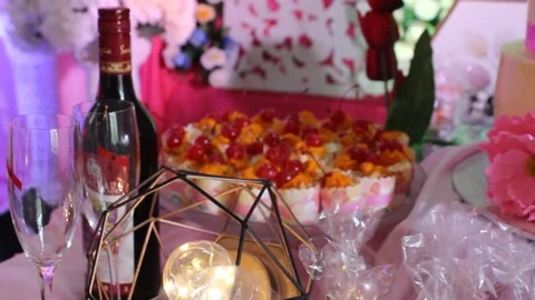 Red Wine on event with cup cake on celebrating table Stock Footage 146202931