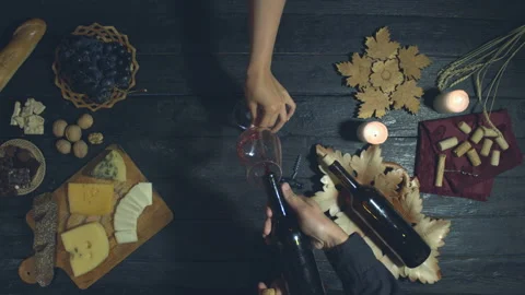Red wine on exotic black table. Top View. Видео 119198512
