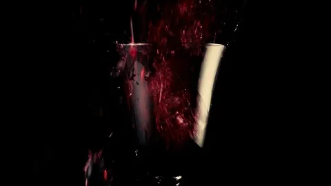 Red wine falls into a beautiful goblet Stock Footage 74877953