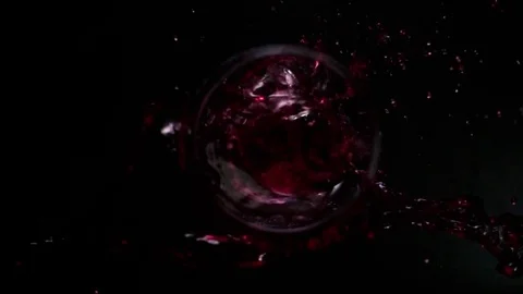 Red wine falls into the glass top Stock Footage 74877148