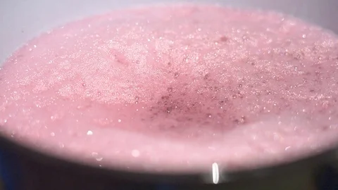 Red wine flows out from tap of a tank inside a wine cellar Stock-Footage 87291797