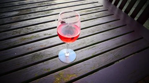 Red wine glass on the table  Stock Photos