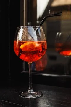 Red wine glass on the wooden table Stock Photos