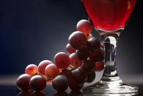 Red wine with grapes Stock Photos
