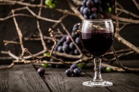 Red wine with grapes Stock Photos