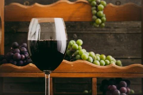Red wine with grapes Stock Photos