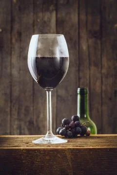 Red wine with grapes Stock Photos