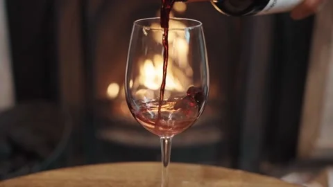 Red wine pour in front of fire - Slow motion. Stock Footage 142936112