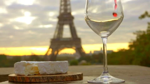 Red wine is poured into glass next to Eiffel Tower Stock Footage 118463501