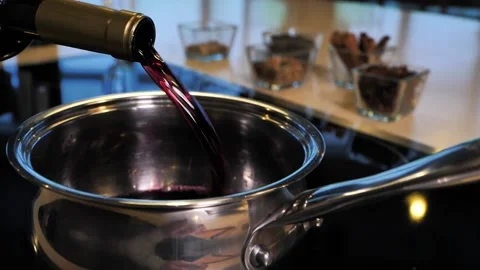 Red wine is poured into the pan for making mulled wine. Video stock 147442938