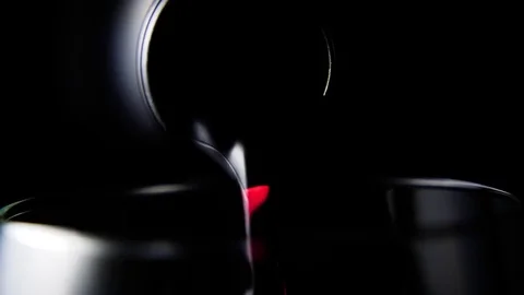 Red wine is pouring from a bottle. Slow motion Stock Footage 73990907
