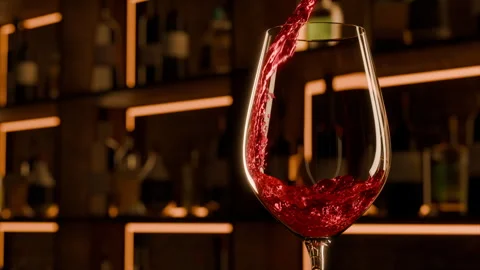 Red wine pouring in close up slow motion. Cozy evening bar celebration Stock Footage 295212394