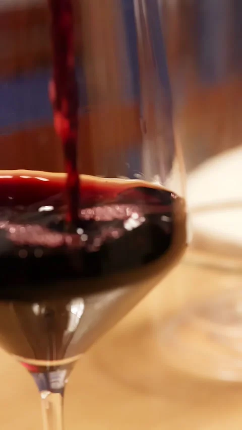 Red Wine Pouring Into Elegant Glassware During Luxury Dinner Service Stock Footage 337757931