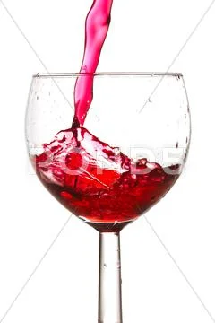 Red wine pouring into glass Stock Photos