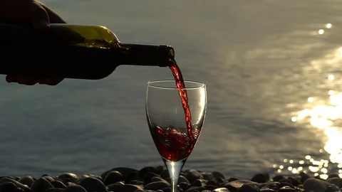 Red Wine Pouring At Sunset. Stock Footage 96468574