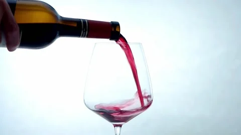 Red wine pouring white background / Rotwein Stock Footage 52129031