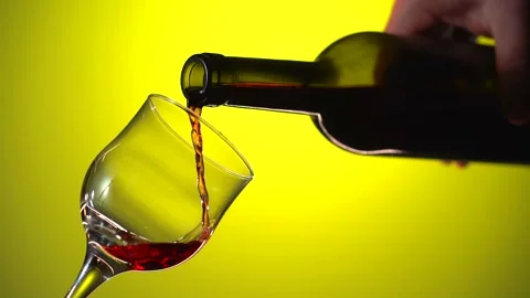 Red wine slow motion pour into glass Video stock 301516217