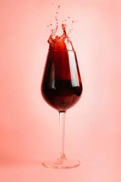 Red wine splash in a glass, dynamic picture, selective focus. Stock Photos
