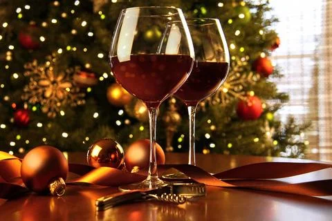 Red wine on table Christmas tree Stock Photos