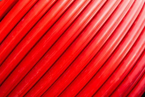 Red wire cable in reels close up background Stock Photos