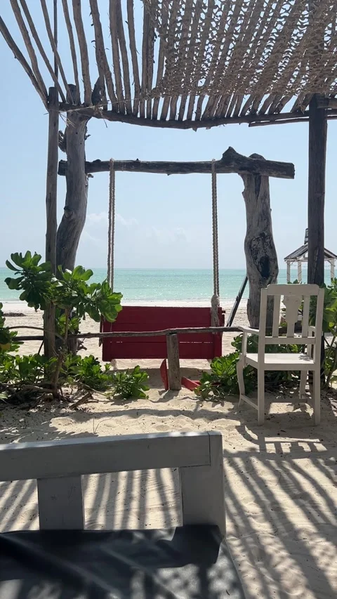 Red wooden beach swing looking at ocean view resort shade Paje Zanzibar HD Stock-Footage 342170550