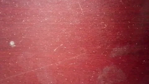 Red wooden surface with scratched texture and dust a detailed shot Vídeos de archivo 337316161