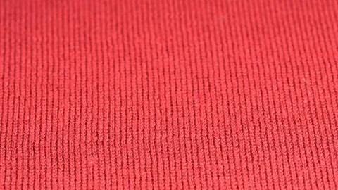 Red wool fabric plain surface close up sliding. Shallow DOF. Dolly shot Stock Footage 121377195