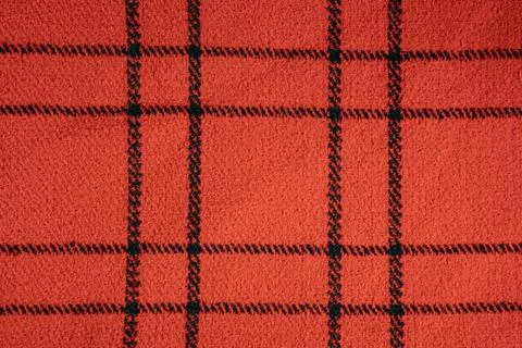 Red wool textile with black checkered plaid square pattern surface Stock Photos