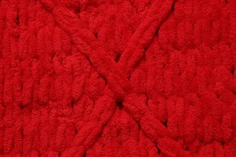 Red woolen fabric with geometrical pattern as background, top view Stock Photos