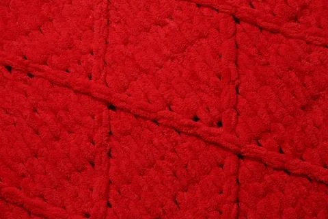 Red woolen fabric with geometrical pattern as background, top view Stock Photos