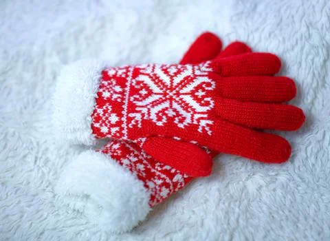 Red woolen mittens on a white background Stock Photos